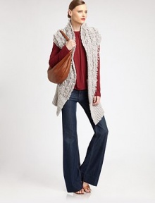 Artfully crafted, wool-rich sweater vest has allover fringe and a cropped back asymmetrical hem. Stand collarCap sleevesSplit, cropped back asymmetrical hemAbout 32 from shoulder to hem68% wool/32% nylonDry cleanImportedModel shown is 5'10 (177cm) wearing US size Extra Small/Small.