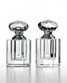 Show some love with perfume bottles from the Heart collection. This meticulously handcrafted pair from Oleg Cassini is topped with heart-shaped stoppers embellished with dazzling faceted cuts. Hallmarked with designer's signature. Show some love with perfume bottles from the Heart collection. This meticulously handcrafted pair from Oleg Cassini is topped with heart-shaped stoppers embellished with dazzling faceted cuts. Hallmarked with designer's signature.