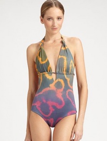 A design with immeasurable charm thanks to braided ties and a bohemian print.Knotted halter strap ties at neckKeyhole detail on frontBack tie closureFully lined92% polyester/8% elastaneHand washImported