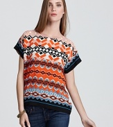 A bold geometric print infuses this Sam & Lavi top with idiosyncratic style while an exposed back zip adds edge.