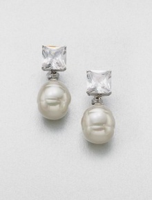 A simple and elegant design featuring a lustrous pearl accented with a brilliant crystal. 14mm round white organic man-made pearlCrystalsSterling silverSize, about 2Post clip backImported 