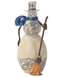Brilliant blue details light up this folksy snowman. With broom in hand and windswept scarf around his neck, this figurine adds new personality to the season. Brilliant blue details light up this folksy snowman. With broom in hand and windswept scarf around his neck, this figurine adds new personality to the season.