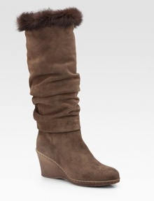 Slightly slouched, weatherproof suede style topped off with a plush rabbit fur trim. Crepe wedge, 3 (75mm) Shaft, 14½ Leg circumference, 15 Rabbit fur cuff Weatherproof suede upper Faux fur lining Rubber sole Padded insole ImportedOUR FIT MODEL RECOMMENDS ordering one half size up as this style runs small. 