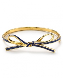 kate spade new york puts a rich spin on the girlish ribbon theme. This sweetly styled bangle is a chic reminder to be jeweled.