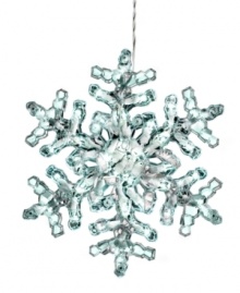 Let it glow. Twinkling clear lights fill a larger-than-life snowflake in this whimsical Christmas decoration from Kurt Adler. Let it glow. Twinkling clear lights fill a larger-than-life snowflake in this whimsical Christmas decoration from Kurt Adler.