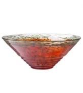 With a modern sensibility inspired by Grecian classics, the Corfu bowl from Kosta Boda accents a room with one-of-a-kind artistry. Blazing orange art glass threaded and textured with hunter green combines a theatrical flare and ribbed finish for unparalleled drama.