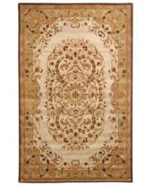 Traditionally inspired elegance. With an ornate motif in soft beige and green hues, Safavieh's Heritage rug takes any room from attractive to stunning in moments. Hand-tufted of pure wool with strong cotton backing, the rug can withstand even the most highly traveled areas of your home. (Clearance) Traditionally inspired elegance. With an ornate motif in soft beige and green hues, Safavieh's Heritage rug takes any room from attractive to stunning in moments. Hand-tufted of pure wool with strong cotton backing, the rug can withstand even the most highly traveled areas of your home. (Clearance)