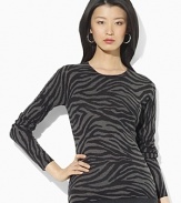 A lustrous silk and cashmere construction lends sultry appeal to a classic crewneck sweater.