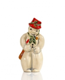 Shaped with a vintage chocolate mold for sweet, one-of-a-kind style, this charming Vaillancourt snowman figurine is hand painted in a dapper red hat and green scarf for extra-festive flair. Shaped with a vintage chocolate mold for sweet, one-of-a-kind style, this charming Vaillancourt snowman figurine is hand painted in a dapper red hat and green scarf for extra-festive flair.