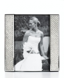Display a wedding photo with the glitz and glam it deserves in this silver-plated picture frame from Leeber. Clear crystals add extravagant shine to happy memories. Display a wedding photo with the glitz and glam it deserves in this silver-plated picture frame from Leeber. Clear crystals add extravagant shine to happy memories.
