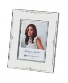 The stylized florals of Modern Love branch out on this gleaming silver-plated picture frame by Monique Lhuillier for Royal Doulton. A timeless balance of refinement and whimsy keeps memories fresh. The stylized florals of Modern Love branch out on this gleaming silver-plated picture frame by Monique Lhuillier for Royal Doulton. A timeless balance of refinement and whimsy keeps memories fresh.
