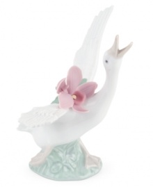 With her beak to the sky and a bouquet of orchids in tow, this graceful duck is on the move in magnificent Lladro porcelain. With her beak to the sky and a bouquet of orchids in tow, this graceful duck is on the move in magnificent Lladro porcelain.
