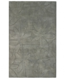 Expanding on classic rug motifs, this modern piece features a clean design of oversized leaves, virtually imprinted on an cool gray background. New Zealand wool is tufted by hand, creating a premium-quality rug with thick, dense pile. Expanding on classic rug motifs, this modern piece features a clean design of oversized leaves, virtually imprinted on an cool gray background. New Zealand wool is tufted by hand, creating a premium-quality rug with thick, dense pile.
