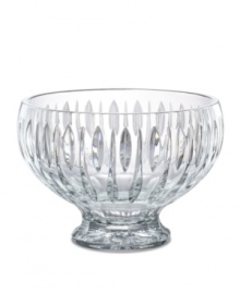 A series of vertical wedge cuts around the side of this lead crystal bowl create an effect of subtle radiance. Measuring 10 in diameter with a dramatic raised base. A series of vertical wedge cuts around the side of this lead crystal bowl create an effect of subtle radiance. Measuring 10 in diameter with a dramatic raised base.