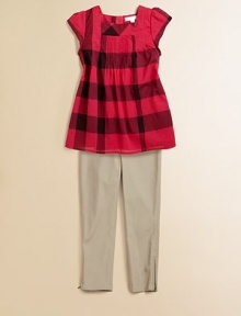 Large, colorful checks and a flared hem add to the allure of this tasteful knit.SquareneckShort sleevesBack button closurePintucked frontFlared hemCottonDry cleanImported Please note: Number of buttons may vary depending on size ordered. Large, colorful checks and a flared hem add to the allure of this tasteful knit.SquareneckShort sleevesBack button closurePintucked frontFlared hemCottonDry cleanImported Please note: Number of buttons may vary depending on size ordered.
