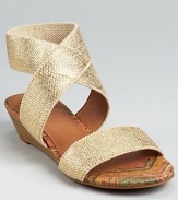 A stacked demi wedge gives a light lift to these Lucky Brand sandals, shimmering in metallic linen.