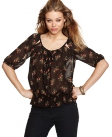 GUESS? updates the peasant blouse with demure cutouts and a pretty floral print! Dress this top with your favorite skinnies for a casual day look that holds it's own! GUESS? updates the peasant blouse with demure cutouts and a pretty floral print! Dress this top with your favorite skinnies for a casual day look that holds it's own!