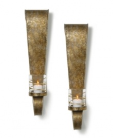 Equal parts wall art and lighting solution, the Symphony Ribbon sconce by Mikasa illuminates a room with modern romance. Featuring a sculpted metal arm and glass candle holder wrapped in ribbons of shimmering gold. Equal parts wall art and lighting solution, the Symphony Ribbon sconce by Mikasa illuminates a room with modern romance. Featuring a sculpted metal arm and glass candle holder wrapped in ribbons of shimmering gold.