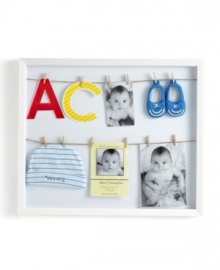 Get hung up on your little one's adorable beginnings with an Umbra picture frame that doubles as a shadowbox. Two lines and a dozen clothespins mean you can give more than a snapshot into his first years. Get hung up on your little one's adorable beginnings with an Umbra picture frame that doubles as a shadowbox. Two lines and a dozen clothespins mean you can give more than a snapshot into his first years.