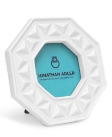 A geometric shape and raised triangle motif in matte porcelain lend this Charade picture frame by Jonathan Adler to happy-chic living room or bedroom decor. A geometric shape and raised triangle motif in matte porcelain lend this Charade picture frame by Jonathan Adler to happy-chic living room or bedroom decor.