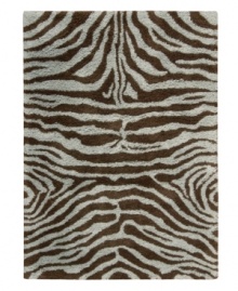 Exotic designs will be the pride of your decor. Adorned with zebra stripes in aqua blue and brown, this Nourison rug has a marvelously soft and shaggy pile that's hand-tufted from premium-quality yarns. Beautiful in appearance and plush underfoot, this area rug creates an atmosphere of casual elegance. Exotic designs will be the pride of your decor. Adorned with zebra stripes in aqua blue and brown, this Nourison rug has a marvelously soft and shaggy pile that's hand-tufted from premium-quality yarns. Beautiful in appearance and plush underfoot, this area rug creates an atmosphere of casual elegance.