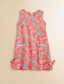 A vibrant floral print meets a classic cotton shift with lace-trimmed patch pockets and bows for a look blooming with style.JewelneckSleevelessBack zipperPatch pocketsSide vents with bowsFully linedCottonMachine washImported