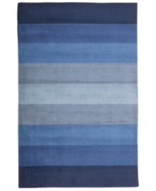 Hand-tufted, blended wool gives an exceptionally soft feel to this rug from the Coastal Treasures collection. In a shimmering, striped design of ocean-blue colorways, this sophisticated piece adds serene character to every decor. Hand-tufted, blended wool gives an exceptionally soft feel to this rug from the Coastal Treasures collection. In a shimmering, striped design of ocean-blue colorways, this sophisticated piece adds serene character to every decor.